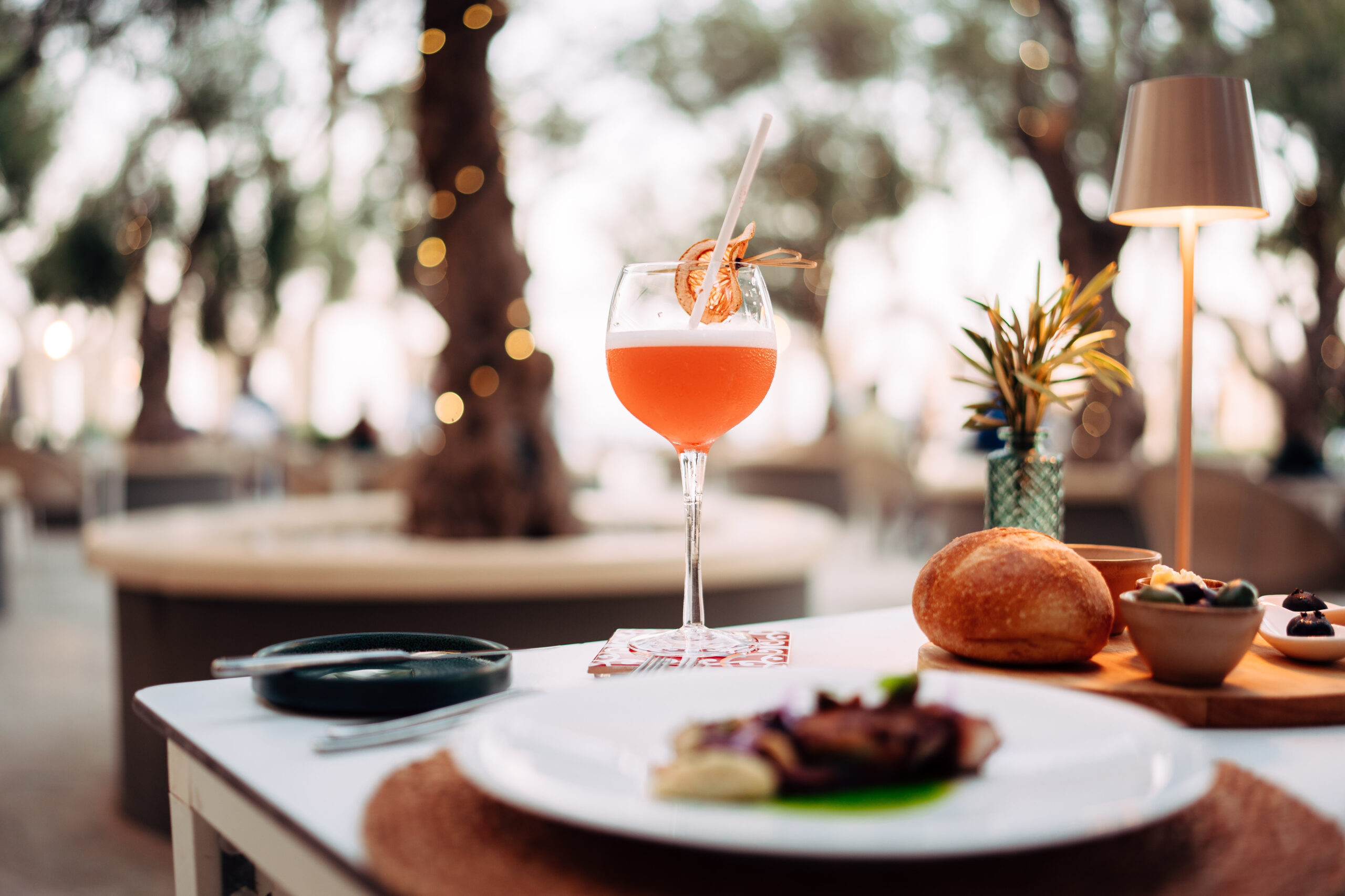 A cocktail on a restaurant table 